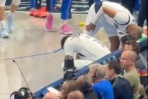 浓眉在场边蹲着抚摸小腿许久 队友们满脸担忧